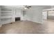 Spacious living room with cozy fireplace and white built-ins at 1337 Eastside Ave, Albemarle, NC 28001