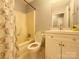 Well-lit bathroom with a bathtub/shower combination and a white vanity for storage at 1407 Clarksville Campground Rd, Monroe, NC 28112