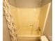Full bathroom with beige tub, shower and floral shower curtain at 1407 Clarksville Campground Rd, Monroe, NC 28112