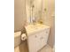Bathroom with a white vanity and sink with a toilet and toilet paper holder at 1407 Clarksville Campground Rd, Monroe, NC 28112