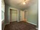 Bedroom offers wood-look flooring, ceiling fan, closet, and is freshly painted at 1407 Clarksville Campground Rd, Monroe, NC 28112