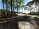 Secluded house in the woods with mature trees and a long driveway at 1407 Clarksville Campground Rd, Monroe, NC 28112