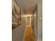 Hallway with wooden floors and soft gray walls featuring a painting and doors at 1407 Clarksville Campground Rd, Monroe, NC 28112
