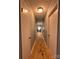 A hallway with doors on either side and hardwood flooring at 1407 Clarksville Campground Rd, Monroe, NC 28112