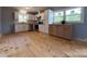Spacious kitchen features bright white cabinets, stainless appliances, and hardwood flooring at 1407 Clarksville Campground Rd, Monroe, NC 28112