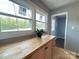 Bright kitchen features wooden cabinets and a double window view at 1407 Clarksville Campground Rd, Monroe, NC 28112