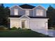 Charming two-story home featuring a two-car garage and a beautifully landscaped front yard at 142 Aberdeen Dr, Salisbury, NC 28144
