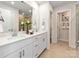 Modern bathroom with dual sinks, granite countertops, white cabinets, and a walk-in shower, creating a spa-like experience at 143 Shepherds Landing Dr, Mooresville, NC 28115