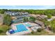Aerial view of a community pool with slide, tennis courts, clubhouse and common areas at 15710 Oleander Dr, Charlotte, NC 28278