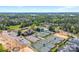 Aerial view of a community pool, tennis courts, clubhouse and partially completed construction at 15710 Oleander Dr, Charlotte, NC 28278
