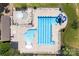 Top-down aerial view of a community pool featuring a slide, fountain and baby pool at 15710 Oleander Dr, Charlotte, NC 28278