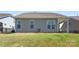 Backyard features a patio, air conditioner, and a neatly maintained lawn at 15710 Oleander Dr, Charlotte, NC 28278