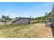 Large backyard with black fence, well-maintained lawn and views of neighboring homes at 15710 Oleander Dr, Charlotte, NC 28278