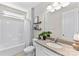 Bathroom featuring granite counters, shower-tub, and decorative shelves at 15710 Oleander Dr, Charlotte, NC 28278