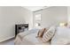 Bedroom featuring a decorated bed, dark wood cabinet, and a bright window at 15710 Oleander Dr, Charlotte, NC 28278