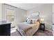 Cozy bedroom featuring a plush bed, side tables with lamps, and a window at 15710 Oleander Dr, Charlotte, NC 28278