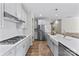 Modern kitchen features stainless steel appliances, white cabinets, and spacious island at 15710 Oleander Dr, Charlotte, NC 28278