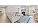 Inviting living room featuring a fireplace, large windows, hardwood floors, and comfortable seating, ideal for gatherings at 15710 Oleander Dr, Charlotte, NC 28278