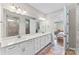 Main bathroom features a double sink vanity with a large mirror and a walk-in shower at 15710 Oleander Dr, Charlotte, NC 28278
