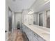 Main bathroom features a double sink vanity, large mirror, and tiled walk-in shower at 15710 Oleander Dr, Charlotte, NC 28278