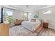 Sunlit main bedroom with large windows, tray ceiling, and ample closet space at 15710 Oleander Dr, Charlotte, NC 28278