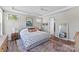 Well lit main bedroom featuring a tray ceiling, light colored walls and carpet at 15710 Oleander Dr, Charlotte, NC 28278