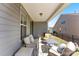 Comfortable covered patio with outdoor furniture and open views to the backyard at 15710 Oleander Dr, Charlotte, NC 28278