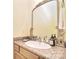 Bathroom vanity featuring granite countertops, a decorative mirror, and neutral walls at 16610 Blackberry Hills Dr, Midland, NC 28107