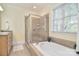 Bathroom features a soaking tub, shower, and large window at 16610 Blackberry Hills Dr, Midland, NC 28107