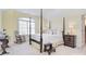 Cozy bedroom with four poster bed, complemented by soft light and charming decor at 16610 Blackberry Hills Dr, Midland, NC 28107