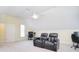 Bonus room featuring theater-style seating, built-in desks, and a ceiling fan at 16610 Blackberry Hills Dr, Midland, NC 28107