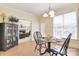 Sunny breakfast nook with a small dining table and a view into the living room at 16610 Blackberry Hills Dr, Midland, NC 28107
