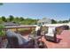 Relaxing deck with wicker furniture, throw pillows and views of fenced backyard at 16610 Blackberry Hills Dr, Midland, NC 28107