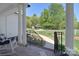 Inviting front porch with a view of the meticulously landscaped front yard, driveway, and surrounding greenery at 16610 Blackberry Hills Dr, Midland, NC 28107