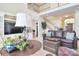 Spacious living room with a two-story ceiling, a staircase, and comfortable leather furniture at 16610 Blackberry Hills Dr, Midland, NC 28107