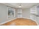 Bright dining room with hardwood floors, built-in shelving, and a large window at 2001 S Main St, Kannapolis, NC 28081