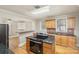 Modern kitchen with stainless steel appliances, granite countertops, and an open view to dining at 2001 S Main St, Kannapolis, NC 28081