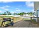 View of the wooden deck with grill, wood railing, and a view of the community at 221 Mountain Island Dr, Statesville, NC 28677