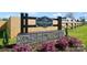 View of the Northlake gated community entrance with stone base and flower bed at 221 Mountain Island Dr, Statesville, NC 28677
