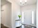 Inviting entryway with half-round table, pendant lighting, and sidelights at 221 Mountain Island Dr, Statesville, NC 28677