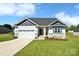 Charming single Gathering home with well maintained lawn and two car garage at 221 Mountain Island Dr, Statesville, NC 28677