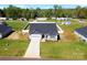 Aerial view of a new home with attached garage in a landscaped yard at 221 Mountain Island Dr, Statesville, NC 28677