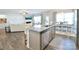 Open-concept kitchen island flows into the adjacent living and dining areas with lots of natural light at 221 Mountain Island Dr, Statesville, NC 28677