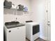 Well-equipped laundry room with modern washer and dryer units at 221 Mountain Island Dr, Statesville, NC 28677