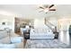 Open-concept living room featuring hardwood floors and neutral tones connects to kitchen and dining area at 221 Mountain Island Dr, Statesville, NC 28677