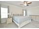 Serene main bedroom features neutral colors, a ceiling fan, and natural light at 221 Mountain Island Dr, Statesville, NC 28677