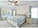Spacious main bedroom with neutral decor, a ceiling fan, and an abundance of natural light at 221 Mountain Island Dr, Statesville, NC 28677