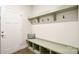 Functional mudroom with storage bench, cubbies, hooks, and an exterior door at 221 Mountain Island Dr, Statesville, NC 28677