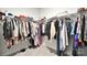 Spacious walk-in closet with ample hanging space, shelves for storage, and carpeted flooring at 221 Mountain Island Dr, Statesville, NC 28677