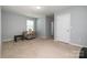 This flexible spare room features neutral carpeting and decor, and is currently furnished with a comfy sofa at 2220 Atwell Glen Ln, Pineville, NC 28134